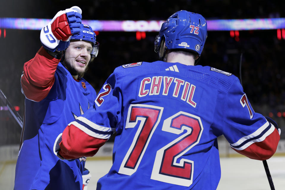 New York Rangers left wing Artemi Panarin, left, is congratulated by Filip Chytil (72) after scoring a goal against the Montreal Canadiens in the second period of an NHL hockey game Sunday, Jan. 15, 2023, in New York. (AP Photo/Adam Hunger)