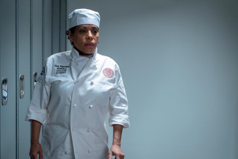 Liza Colón-Zayas wearing a chef's coat and hat in The Bear