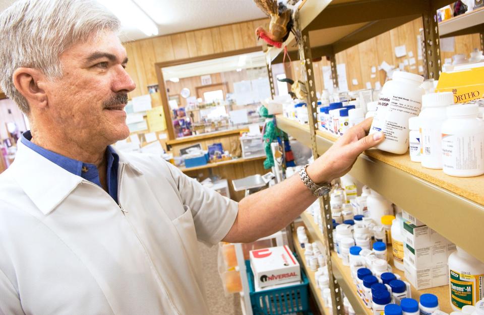 Gary Linderman, owner of Ole Miners Pharmacy in Picher, fills a prescription. The pharmacy still is open despite a cut-off date for city services. Photo by Gary Crow, For the Oklahoman