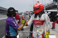 Pietro Fittipaldi, right, of Brazil, is congratulated by a crew member during qualifications for the Indianapolis 500 auto race at Indianapolis Motor Speedway, Saturday, May 22, 2021, in Indianapolis. (AP Photo/Darron Cummings)