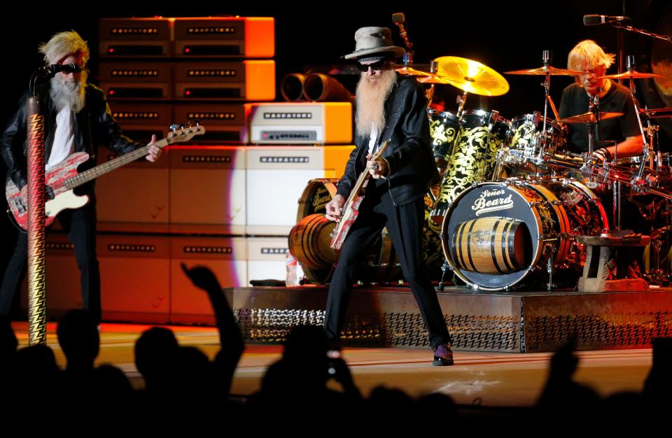 ZZ Top plays the Tuscaloosa Amphitheater Thursday, July 30, 2021, in Tuscaloosa, Ala., following the death of bass player Dusty Hill. Elwood Francis, left, replaced Hill on bass guitar, joining Frank Beard on drums and Billy Gibbons on lead guitar and vocals. [Staff Photo/Gary Cosby Jr.]