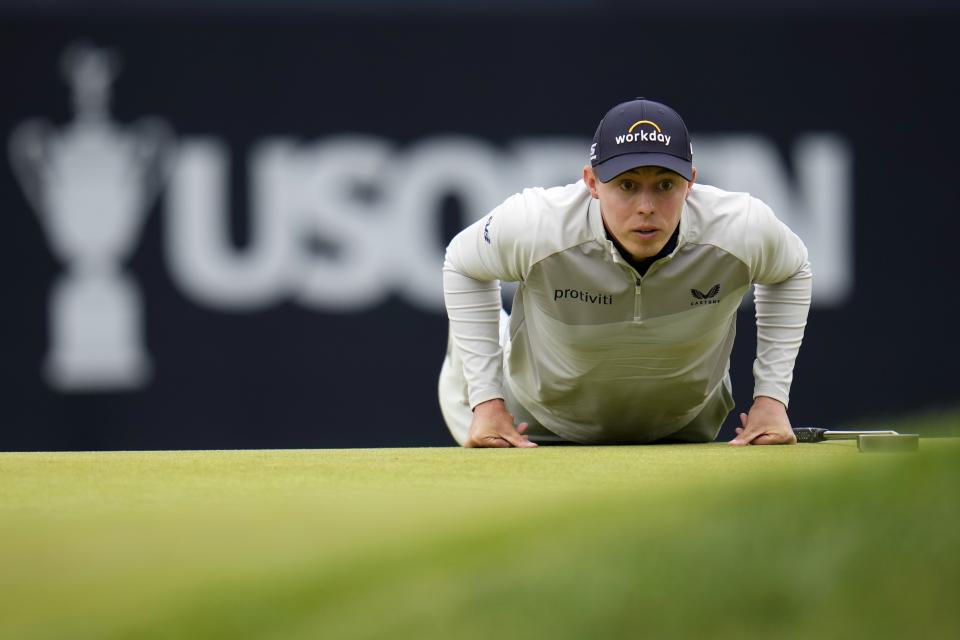 Matthew Fitzpatrick, of England, lines up a putt on the sixth hole during the final round of the U.S. Open golf tournament at The Country Club, Sunday, June 19, 2022, in Brookline, Mass. (AP Photo/Julio Cortez)
