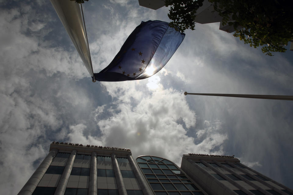 A European Union flag flies outside the Stock Exchange in Athens on Friday, May 25, 2012. Uncertainty over Greece's future in the eurozone has hammered markets ahead of June 17 general elections in the crisis-hit country. The Greek share index touched new 22-year lows, dipping below 500 points. (AP Photo/Thanassis Stavrakis)