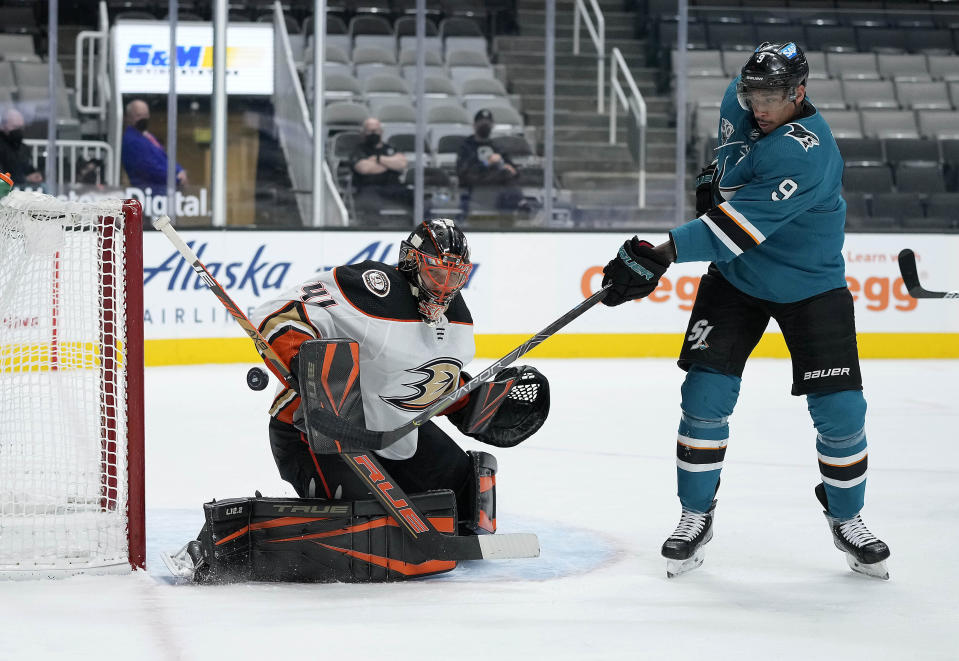 Anaheim Ducks goaltender Anthony Stolarz (41) blocks a shot by San Jose Sharks left wing Evander Kane (9) during the first period of an NHL hockey game Monday, April 12, 2021, in San Jose, Calif. (AP Photo/Tony Avelar)