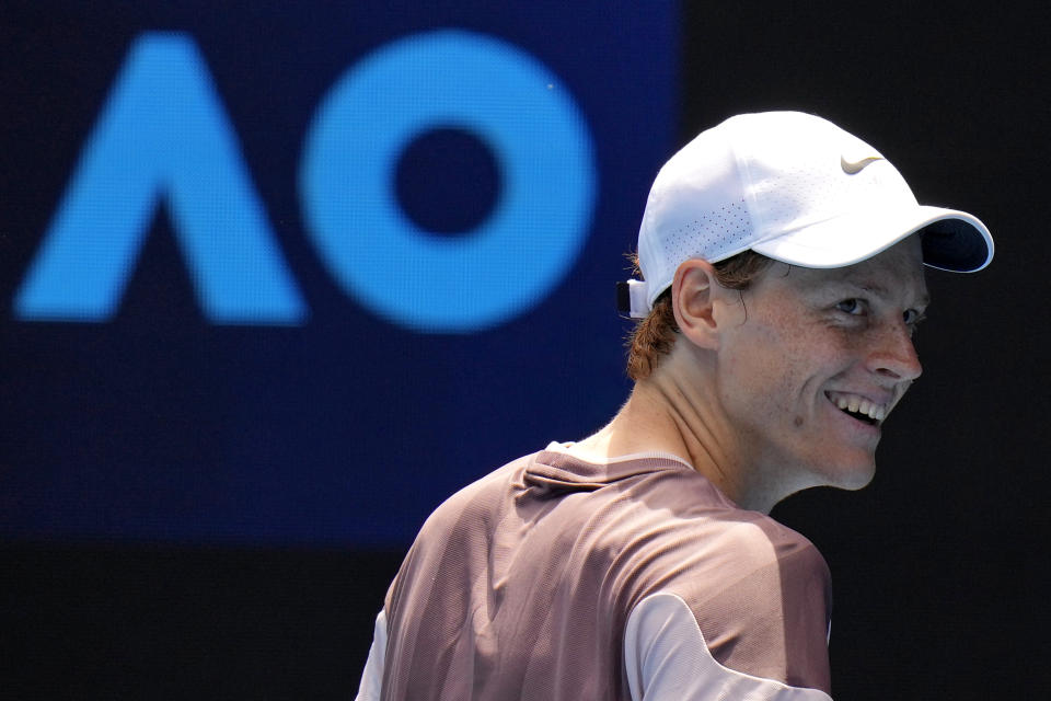 Italy's Jannik Sinner reacts during his first round match against Botic van de Zandschulp of the Netherlands at the Australian Open tennis championships at Melbourne Park, Melbourne, Australia, Sunday, Jan. 14, 2024. (AP Photo/Andy Wong)