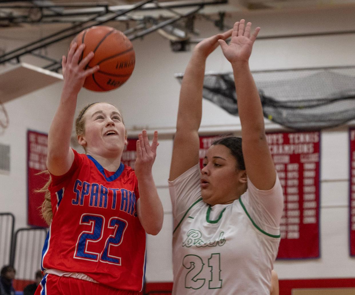 Ocean’s Eli Clark takes a shot off a fast break as Brick’s Ayanna Candelaria tries to block her. Ocean Township High School Girls Basketball dominates Brick High School in NJSIAA Central Jersey Group 3 first round game in Ocean Twp. on February 22,, 2024.