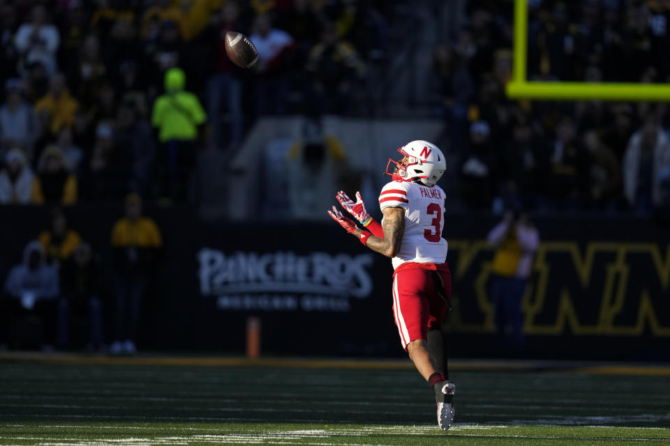 Nebraska wide receiver Trey Palmer catches an 87-yard touchdown pass during the first half of an NCAA college football game against Iowa, Friday, Nov. 25, 2022, in Iowa City, Iowa. (AP Photo/Charlie Neibergall)