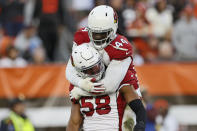 Arizona Cardinals middle linebacker Jordan Hicks (58) celebrates a sack with linebacker Markus Golden (44) during the second half of an NFL football game against the Cleveland Browns, Sunday, Oct. 17, 2021, in Cleveland. (AP Photo/Ron Schwane)