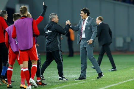 Soccer Football - 2018 World Cup Qualifications - Europe - Georgia vs Wales - Boris Paichadze Dinamo Arena, Tbilisi, Georgia - October 6, 2017 Wales manager Chris Coleman celebrates with assistant manager Osian Roberts after Tom Lawrence scores their first goal REUTERS/David Mdzinarishvili