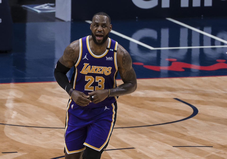 Los Angeles Lakers forward LeBron James (23) celebrates after scoring against the New Orleans Pelicans in the third quarter of an NBA basketball game in New Orleans, Sunday, May 16, 2021. (AP Photo/Derick Hingle)