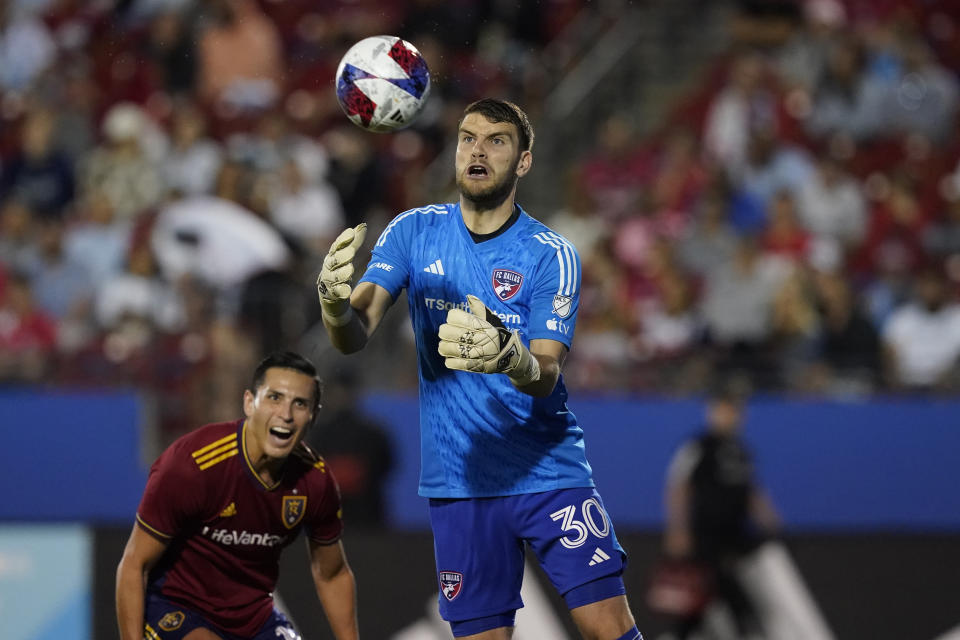 FC Dallas goalkeeper Maarten Paes (30) makes a save as Real Salt Lake forward Jefferson Savarino, left, closes in during the second half of an MLS soccer match Saturday, April 15, 2023, in Frisco, Texas. (AP Photo/LM Otero)