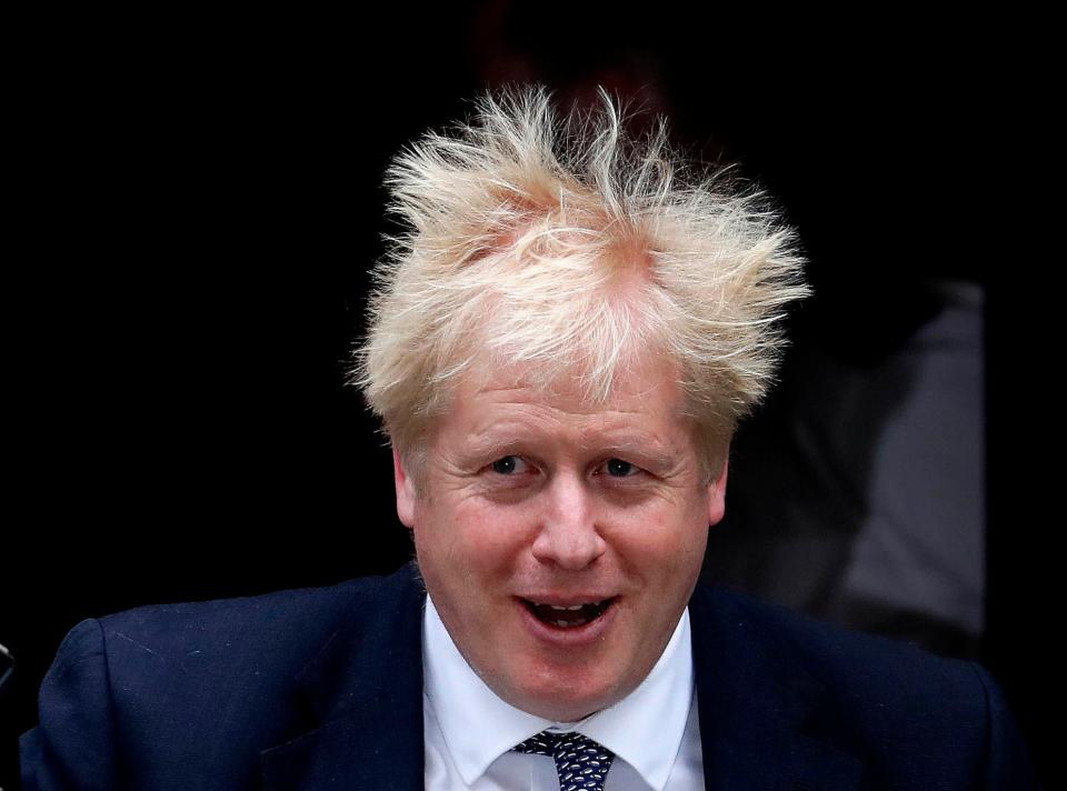 Britain's Prime Minister Boris Johnson leaves 10 Downing Street to attend the weekly Prime Ministers' Questions session, in parliament in London.