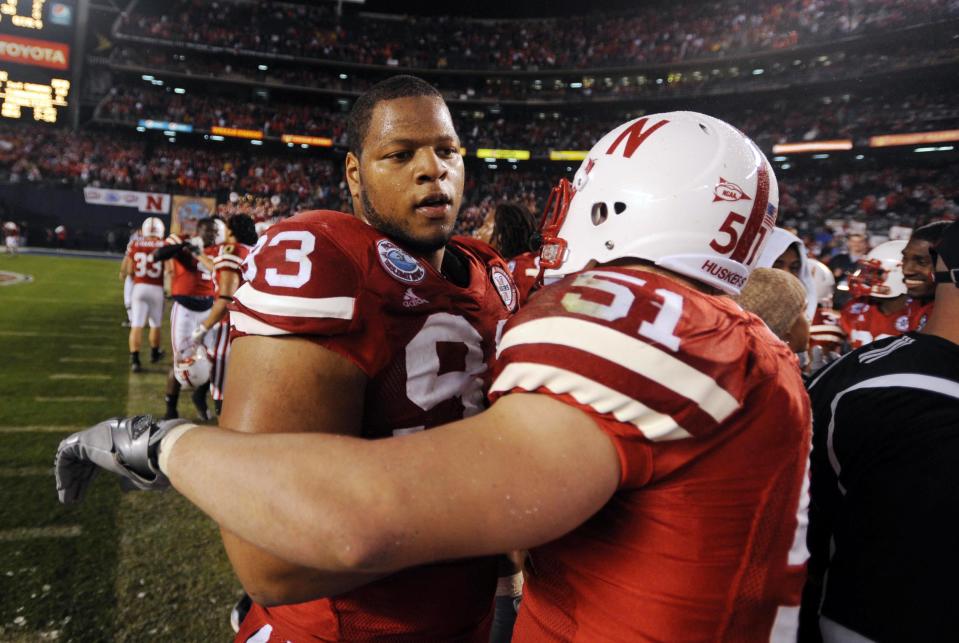 December 30, 2009; San Diego, CA, USA; Nebraska Cornuskers defensive tackle Ndamukong Suh (93) celebrates with linebacker Will Compton (51) following a 33-0 win against the <a class="link " href="https://sports.yahoo.com/ncaaw/teams/arizona/" data-i13n="sec:content-canvas;subsec:anchor_text;elm:context_link" data-ylk="slk:Arizona Wildcats;sec:content-canvas;subsec:anchor_text;elm:context_link;itc:0">Arizona Wildcats</a> during the Holiday Bowl at Qualcomm Stadium. Mandatory Credit: Christopher Hanewinckel-USA TODAY Sports