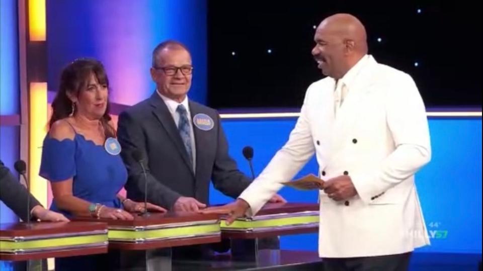 Lori DiSabatino and Angelo Griffith with host Steve Harvey on "Family Feud" Friday night, the last of their family's three episodes on the classic game show.