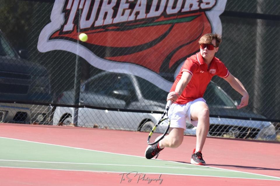 A Boone tennis player returns the ball during a meet this season.