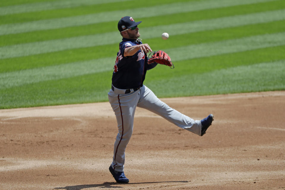 Minnesota Twins third baseman Josh Donaldson throws out Chicago White Sox's Tim Anderson at first during the first inning of a baseball game in Chicago, Saturday, July 25, 2020. (AP Photo/Nam Y. Huh)