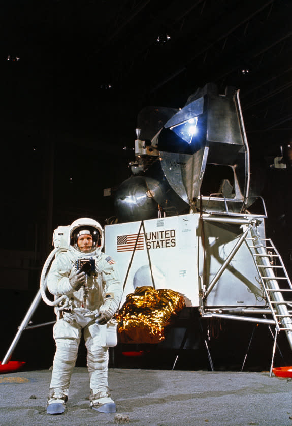 Astronaut Neil A. Armstrong, wearing an Extravehicular Mobility Unit, participates in a simulation of deploying and using lunar tools on the surface of the moon during a training exercise in Building 9 on April 22, 1969. Armstrong is the comman