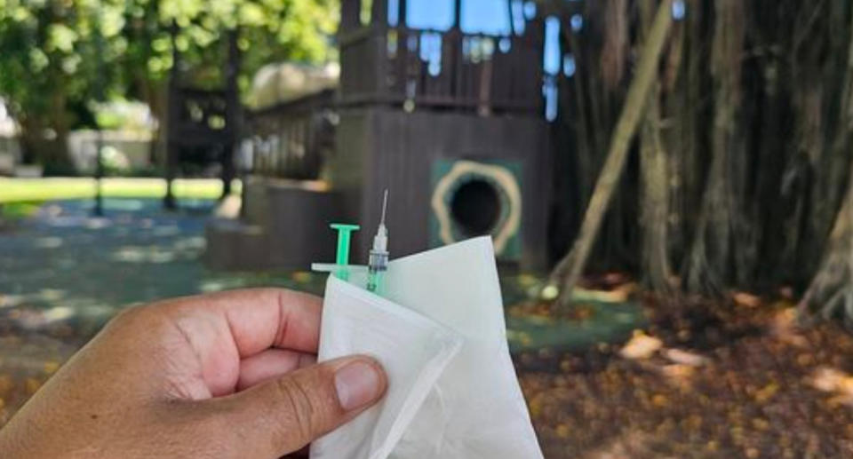 Man holding syringes found in Cairns playground. 