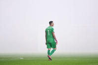 Football Soccer - Italy v Albania - World Cup 2018 Qualifiers - Group G - Renzo Barbera stadium, Palermo, Italy - 24/3/17. Albania's goalkeeper Thomas Strakosha leaves the pitch as the referee suspends the match after Albania's supporters lit flares. REUTERS/Alberto Lingria