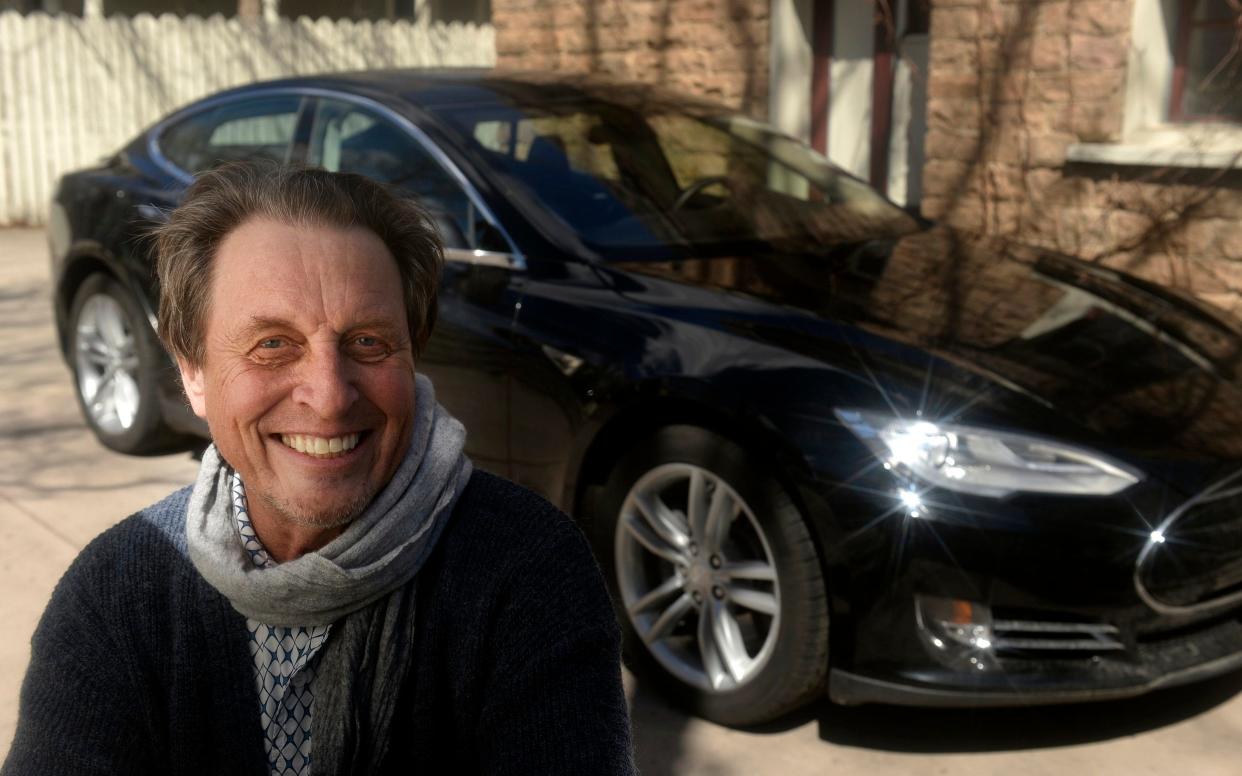 Errol Musk, the father of billionaire entrepreneur Elon Musk, with a Tesla Model S - Denver Post