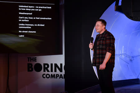 Tesla Inc. founder Elon Musk speaks at the unveiling event by "The Boring Company" for the test tunnel of a proposed underground transportation network across Los Angeles County, in Hawthorne, California, U.S. December 18, 2018. Robyn Beck/Pool via REUTERS