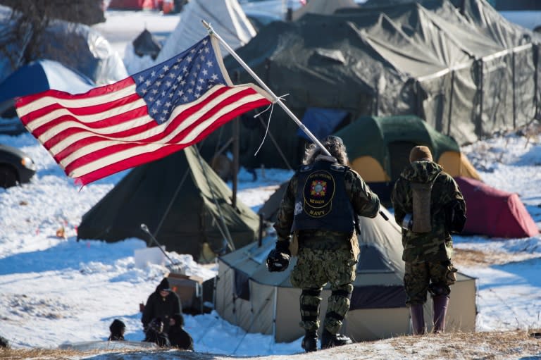 US military veterans joined protests against a controversial planned oil pipeline that have led the Army Corps of Engineers to rethink the route