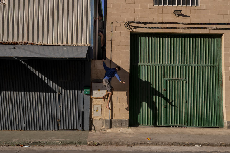 Migrants cross into the Spanish enclave of Ceuta, near the border of Morocco and Spain, Wednesday, May 19, 2021. Spanish officials are acknowledging for the first time that the unprecedented migrant crisis has been triggered by an angry Rabat at Madrid's decision to provide medical treatment to the militant boss of the Polisario Front. (AP Photo/Bernat Armangue)