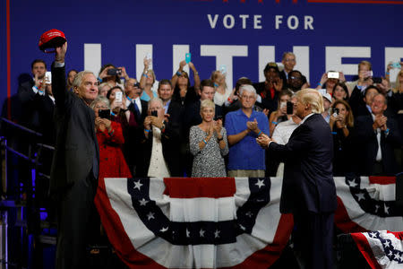 U.S. President Donald Trump and Sen. Luther Strange (R-AL) acknowledge the crowd during a campaign rally in Huntsville, Alabama, U.S. September 22, 2017. REUTERS/Aaron P. Bernstein