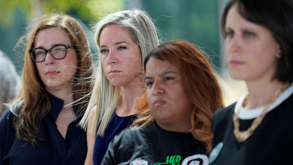 PHOTO: Amanda Zurawski, second from left, and Samantha Casiano, second from right, stand with other plaintiffs and their attorneys outside the Travis County Courthouse, July 19, 2023, in Austin, Texas. (Eric Gay/AP)