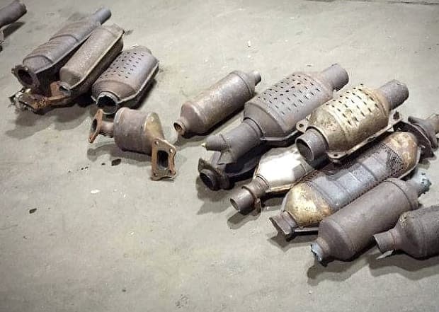 These catalytic converters were recovered by Cape Breton Regional Police during an investigation. Police in Guelph and Waterloo region say thefts of the converters are on the rise. (Submitted by Cape Breton Regional Police - image credit)