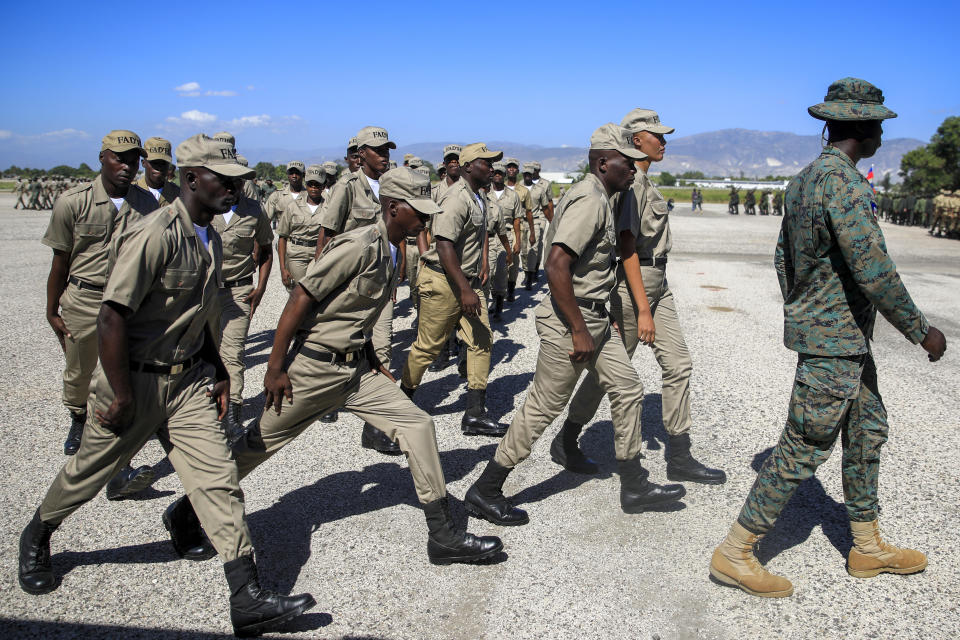 New members of the Haitian Armed Forces parade during their graduation ceremony in Port-au-Prince, Haiti, Thursday, Dec. 22, 2022. (AP Photo/Odelyn Joseph)