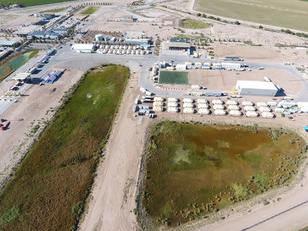 A tent city set up to hold immigrant children separated from their parents or who crossed the U.S. border on their own is seen in Tornillo, Texas, U.S., in this U.S. Department of Health and Human Services (HHS) image released on October 12, 2018. Courtesy HHS/Handout via REUTERS
