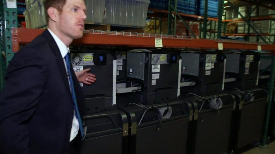 PHOTO: Maricopa County Recorder Stephen Richer shows off the equipment at the Maricopa County Tabulation and Election Center in Phoenix. (ABC News)