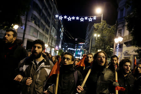 People attend an anniversary rally marking the 2008 police shooting of 15-year-old student, Alexandros Grigoropoulos, in Athens, Greece, December 6, 2017. REUTERS/Costas Baltas