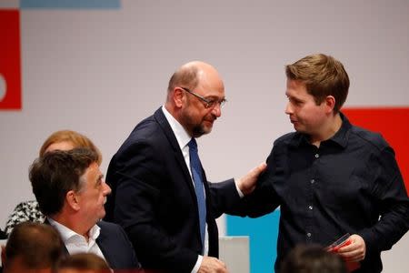 Social Democratic Party (SPD) leader Martin Schulz and Kevin Kuehnert, the head of SPD's youth wing, during an SPD party convention in Berlin, Germany, December 7, 2017. REUTERS/Fabrizio Bensch