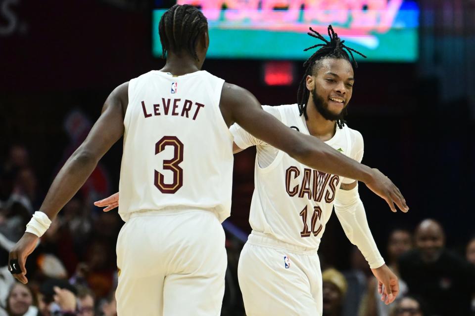 Apr 18, 2023; Cleveland, Ohio, USA; Cleveland Cavaliers guard Caris LeVert (3) and guard Donovan Mitchell (45) celebrate during the second half of game two against the New York Knicks in the 2023 NBA playoffs at Rocket Mortgage FieldHouse. Mandatory Credit: Ken Blaze-USA TODAY Sports