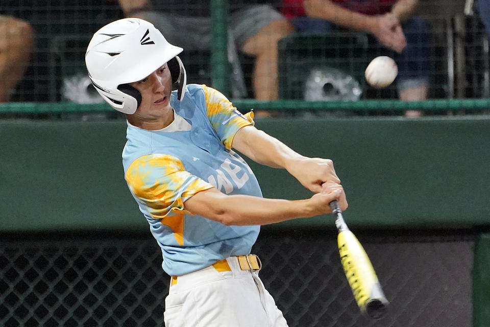 El Segundo, Calif.'s Louis Lappe (19) hits a home run off New Albany, Ohio's Kevin Klingerman during the third inning of a baseball game at the Little League World Series tournament in South Williamsport, Pa., Thursday, Aug. 17, 2023. (AP Photo/Tom E. Puskar)