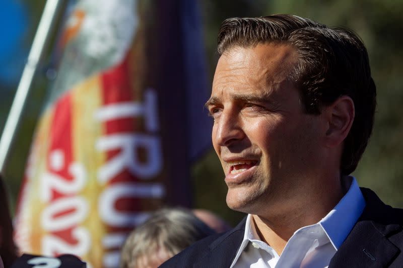 Former Nevada Attorney General Adam Laxalt speaks during a Trump campaign press conference outside the Clark County Election Center in North Las Vegas