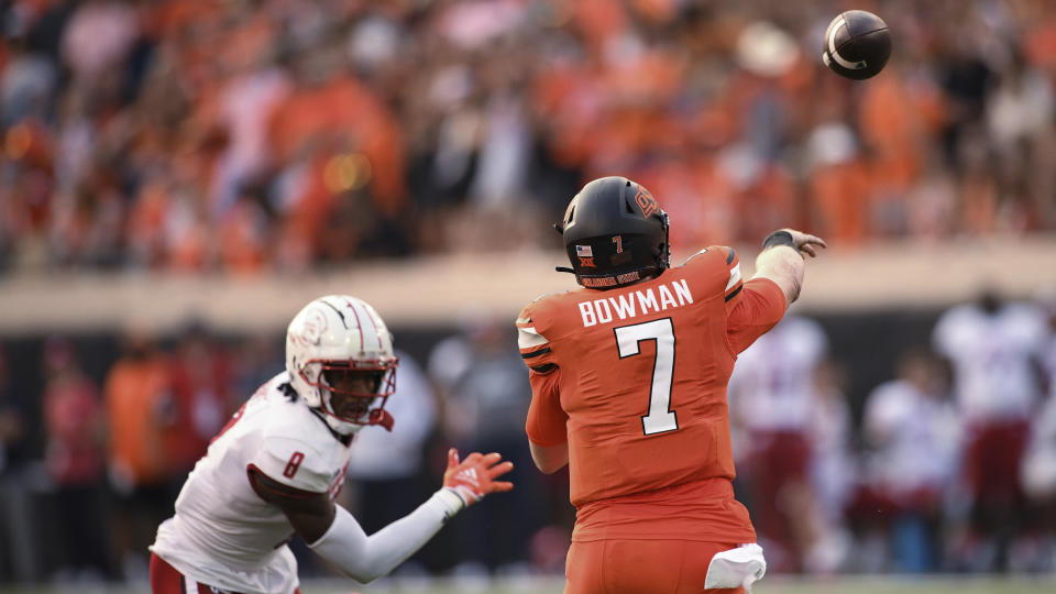 Oklahoma State quarterback Alan Bowman (7) throws a pass that was intercepted, next to South Alabama safety Yam Banks during the first half of an NCAA college football game Saturday, Sept. 16, 2023, in Stillwater, Okla. (AP Photo/Brody Schmidt)