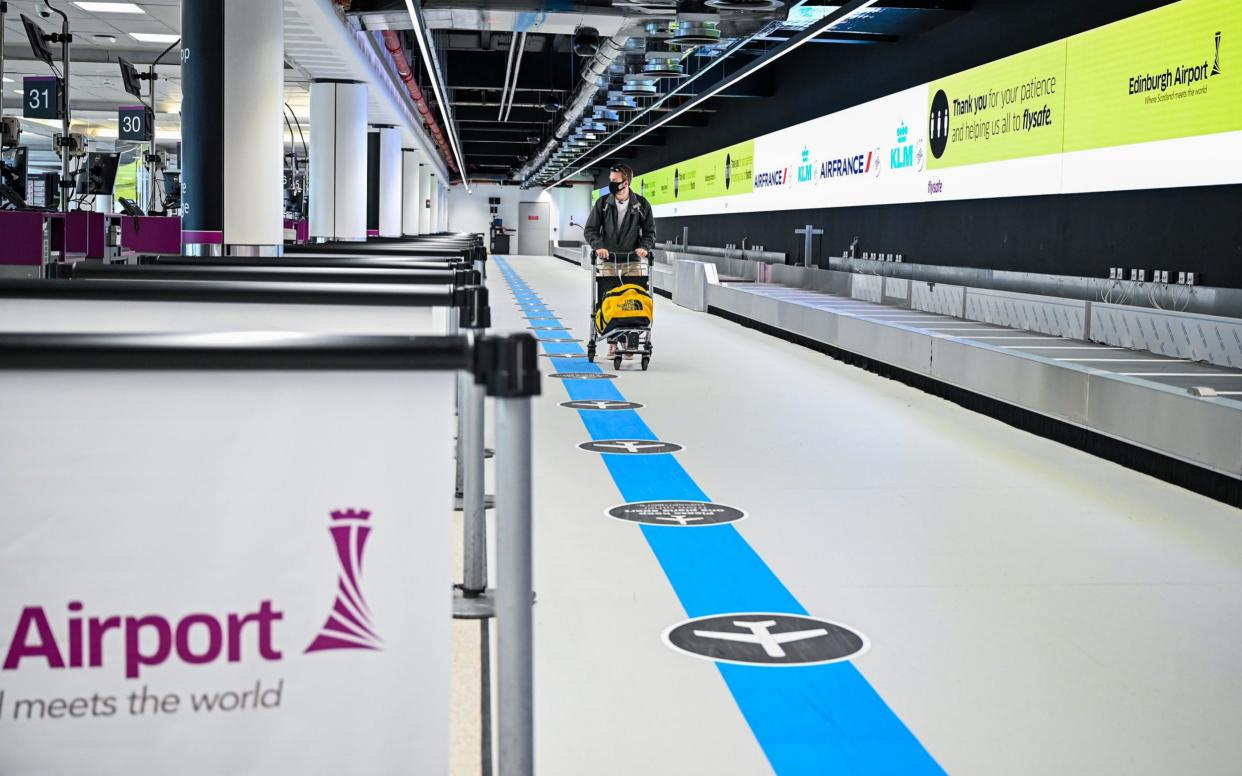 Passengers make their way through the main terminal at Edinburgh Airport on July 7 - Getty Images Europe