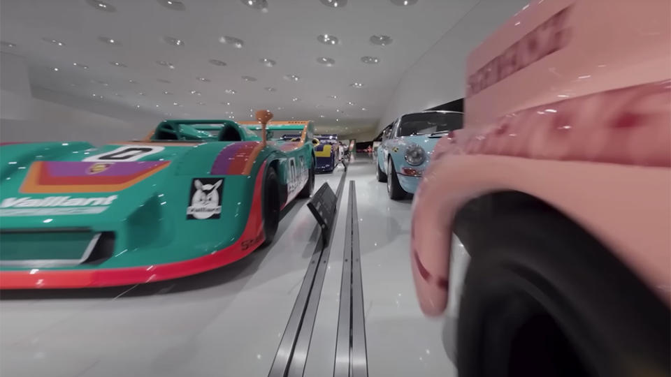 DJi's Avata FPV drone zooms between race cars at the Porsche Museum