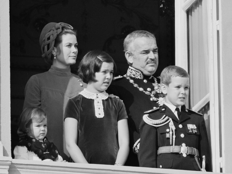 Princess Stephanie, Prince Albert, and Princess Caroline with their parents, Princess Grace and Prince Rainier III of Monaco at the balcony of the royal palace in 1967.