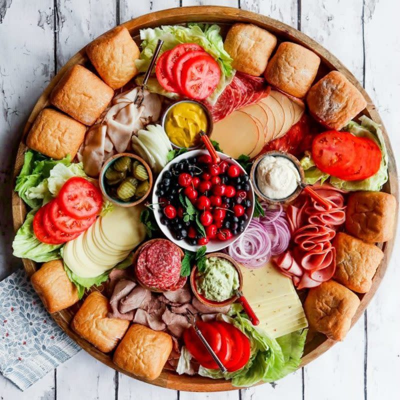 <p>The Reluctant Entertainer</p><p>An epic sandwich charcuterie board for easy hosting and holiday parties. Add your favorite sandwich ingredients so guests can make their own (warm) sandwich!</p><p><strong>Get the recipe: </strong><a href="https://reluctantentertainer.com/epic-sandwich-charcuterie-board/" rel="nofollow noopener" target="_blank" data-ylk="slk:Epic Sandwich Charcuterie Board;elm:context_link;itc:0;sec:content-canvas" class="link rapid-noclick-resp"><strong>Epic Sandwich Charcuterie Board</strong></a></p><p><strong>Related: <a href="https://parade.com/1133477/pipandebby/easy-candy-board-ideas/" rel="nofollow noopener" target="_blank" data-ylk="slk:Candy Boards Are the New Holiday Charcuterie Boards We Can't Get Enough Of;elm:context_link;itc:0;sec:content-canvas" class="link rapid-noclick-resp">Candy Boards Are the New Holiday Charcuterie Boards We Can't Get Enough Of</a></strong></p>