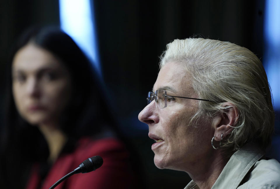 Ukrainian medic Yuliia Paievska, known to Ukrainians by the nickname Taira, right, speak during an appearance before U.S. lawmakers on the Helsinki Commission, Thursday, Sept. 15, 2022 on Capitol Hill in Washington. (AP Photo/Mariam Zuhaib)