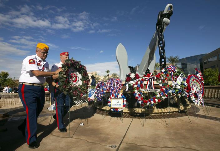 Veterans place memorial wreaths during a Pearl Harbor Remembrance Day event at Wesley Bolin Plaza in Phoenix on Dec. 7, 2018, the 77th anniversary of the attack on Pearl Harbor.