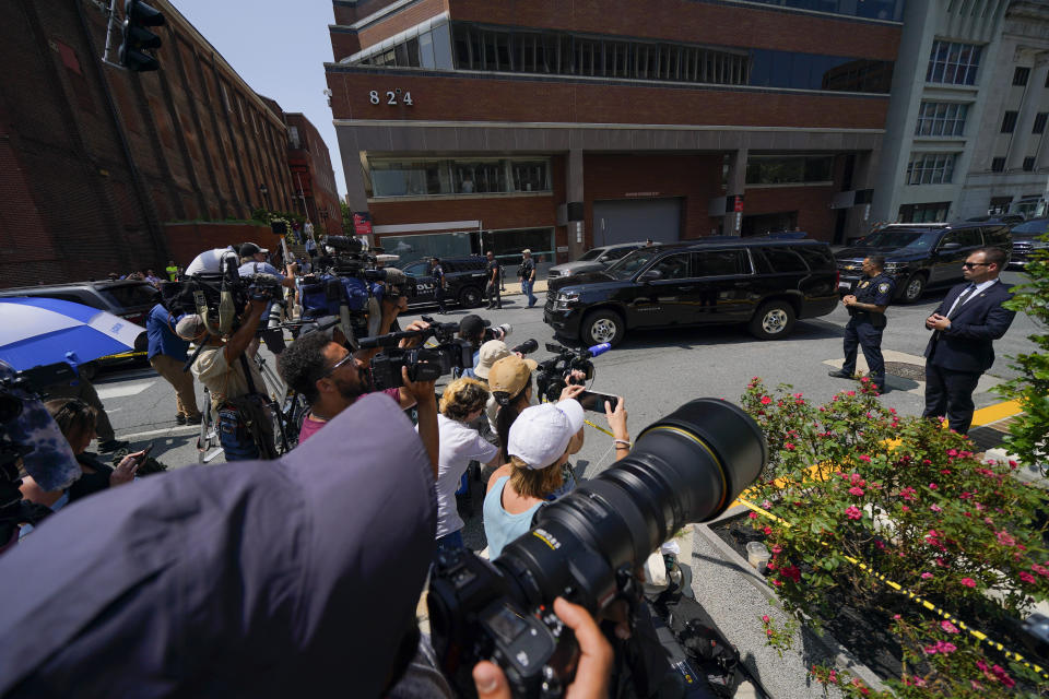 Reporters huddle as a vehicle, top right, leaves with President Joe Biden’s son Hunter Biden, after a court appearance, Wednesday, July 26, 2023, in Wilmington, Del. The plea deal in Hunter Biden’s criminal case unraveled during a court hearing Wednesday after a federal judge raised concerns about the terms of the agreement that has infuriated Republicans who believe the president’s son is getting preferential treatment. (AP Photo/Julio Cortez)