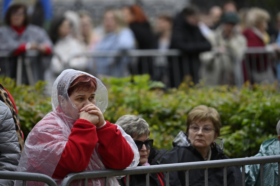 People wait Pope Francis outside the St. Elizabeth of Hungary Church in Budapest, Hungary, Saturday, April 29, 2023. The Pontiff is in Hungary for a three-day pastoral visit. (AP Photo/Denes Erdos)