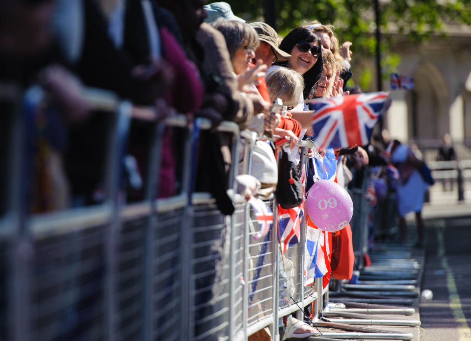 Well wishers waits outside Westminster Abbey, in central London, ahead of a service of celebration to mark the 60th anniversary of Queen Elizabeth II's coronation.