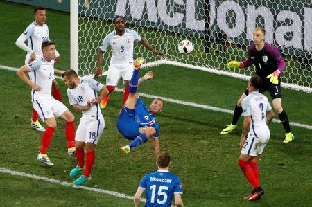 Football Soccer - England v Iceland - EURO 2016 - Round of 16 - Stade de Nice, Nice, France - 27/6/16 Iceland's Ragnar Sigurdsson attempts an overhead kickREUTERS/Yves Herman Livepic