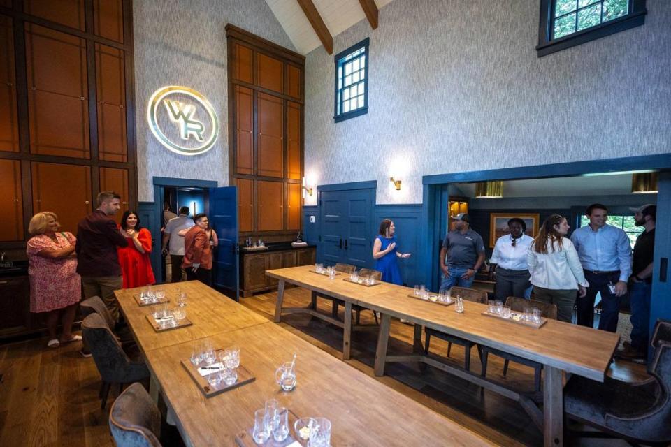 Guests explore the tasting room at the historic Pepper House, built in 1812, at Woodford Reserve Distillery. The house has undergone extensive renovations and will become home to the distillery’s Personal Selection program. A personal selection barrel is when someone blends two barrels or liquor together, creating a unique combination.